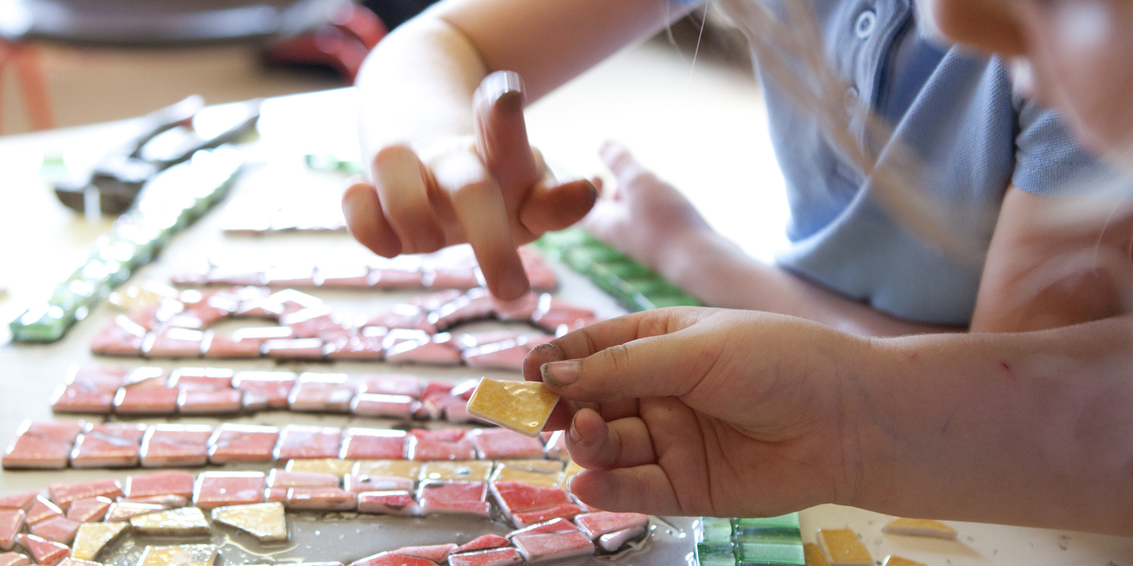 girls making a mosaic in school